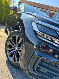 front end of a car with reflective paintwork following deep clean and polish